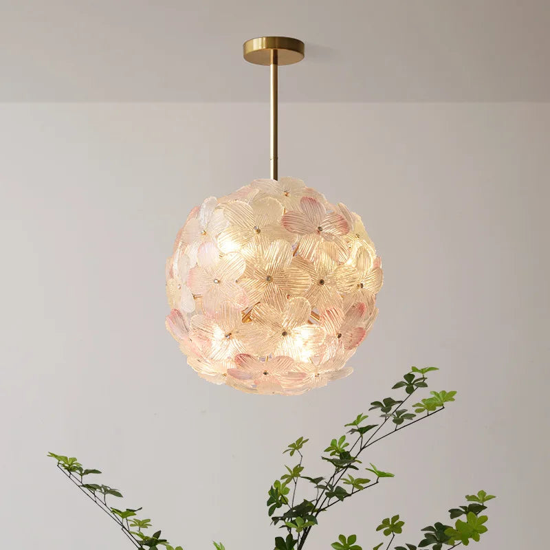 Decorative ceiling light fixture with floral design on a plain background
