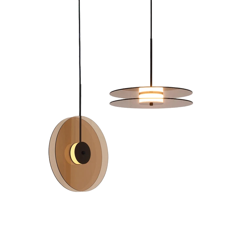 Modern pendant light with circular design on a gray background