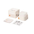 Packaging display showing the keylight mini keyboard light with its box, a small accessory piece, and instruction manual on a clean off-white background. Text at the top reads 'PACKAGING DISPLAY' and the keylight mini logo appears at the bottom right.
