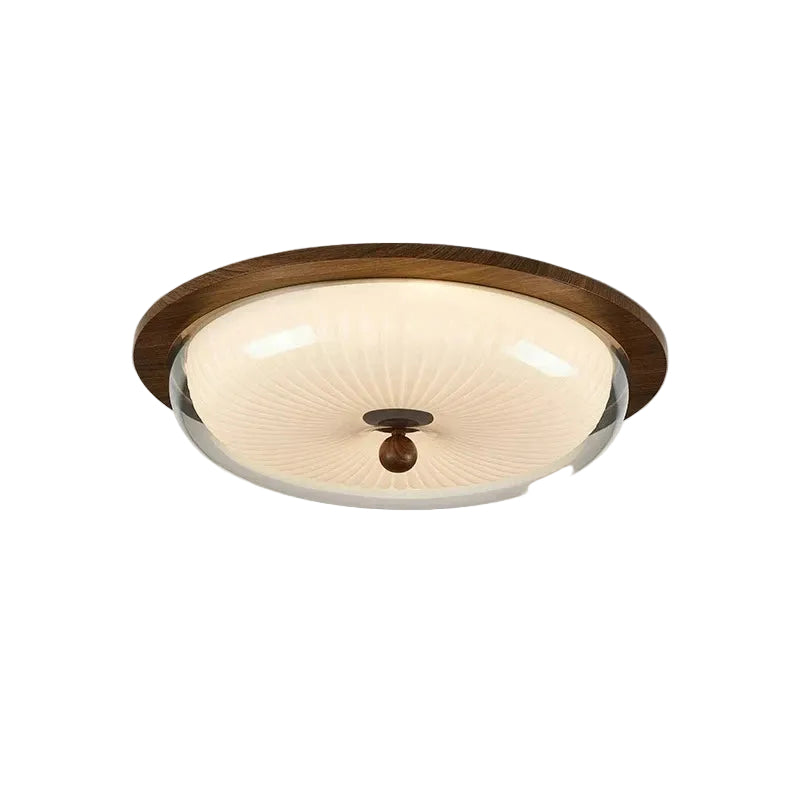 A semi-flush mount ceiling light fixture with a round, ribbed cream glass shade, a dark brown wood-look outer rim, and a central dark brown finial, shown against a plain white background.