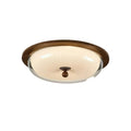 A semi-flush mount ceiling light fixture with a round, ribbed cream glass shade, a dark brown wood-look outer rim, and a central dark brown finial, shown against a plain white background.