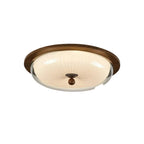 A semi-flush mount ceiling light fixture with a round, ribbed cream glass shade, a dark brown wood-look outer rim, and a central dark brown finial, shown against a plain white background.