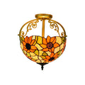 Decorative ceiling light with floral design on a white background