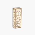 Decorative wall sconce with a geometric cutout design on a white background