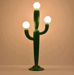 Cactus-shaped lamp with three spherical lights on a beige background