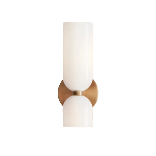 Wall sconce with white glass shades and gold metal base on a white background