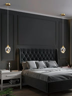 Modern bedroom with dark gray walls, a tufted bed, and decorative pendant lights.