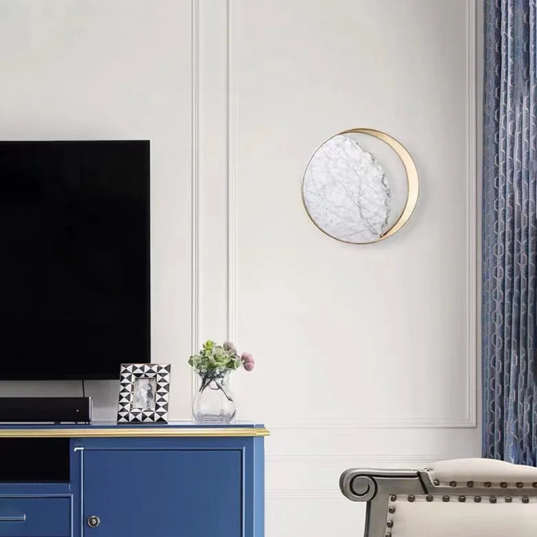Modern living room with a blue cabinet, TV, and decorative elements.