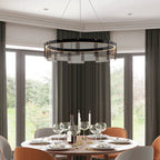Dining room with a modern chandelier, table set for dinner, and large windows.