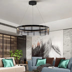 Modern living room with a stylish chandelier, comfortable sofa, and decorative pillows.
