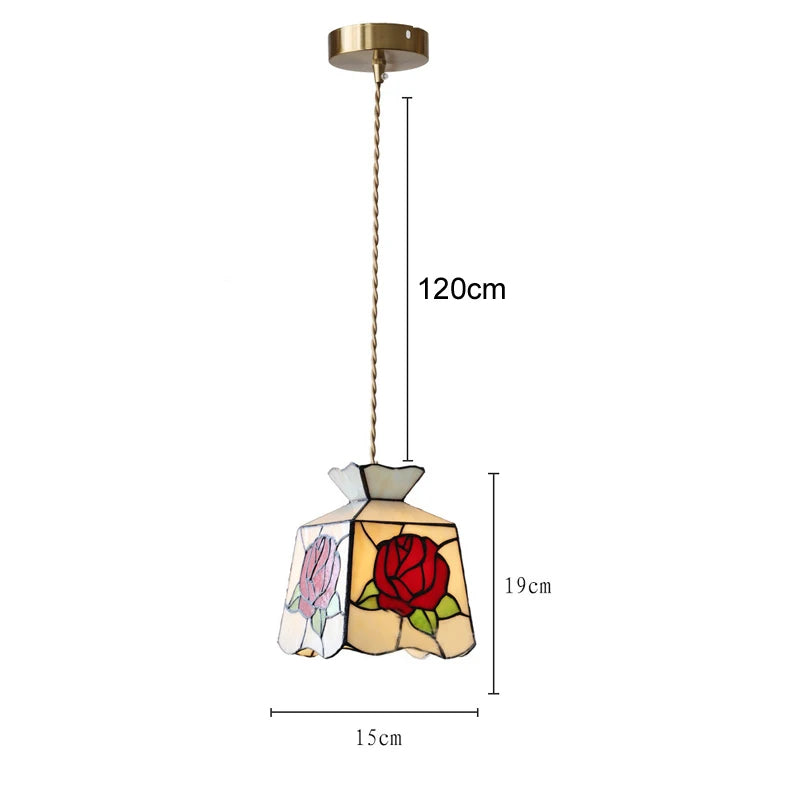 Stained glass pendant light with rose design and dimensions on a white background