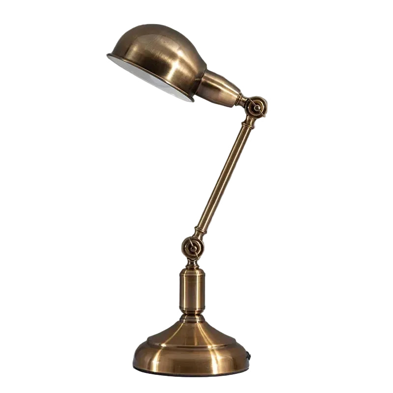 Brass desk lamp on a gray background