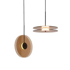 Modern pendant light with circular design on a gray background